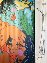 Shower curtain made by artist Kezna Dalz for Costume de bain in a white bathroom with metallic shower head