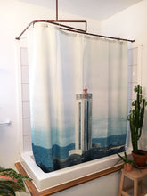 Capture the serenity of a lighthouse with photographer Marc-Étienne Mongrain's stunning shower curtain for Costume de bain in Montreal. Elevate your bathroom decor with this captivating seascape. Shop now for a touch of maritime beauty in your home!