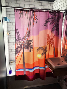 Shower curtain made by Canadian artist Anne Faf. Sunset tropcial beach artwork in purple red and orange shades. 